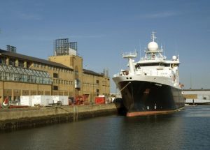 Waterfront Campus National Oceanography Centre building photo with research vessel moored in front